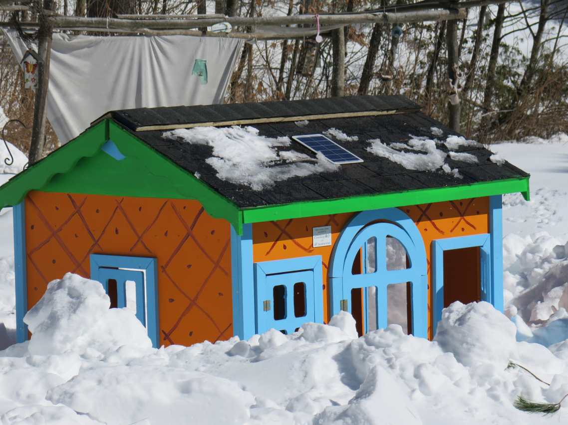 Habitat for Humanity playhouse with solar energy system on the roof