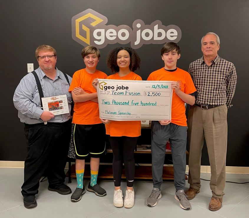 GEO Jobe Presents Check to Team Fusion