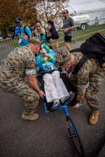 Kerry Gruson helped by Marines (Photo: J. Mendez)