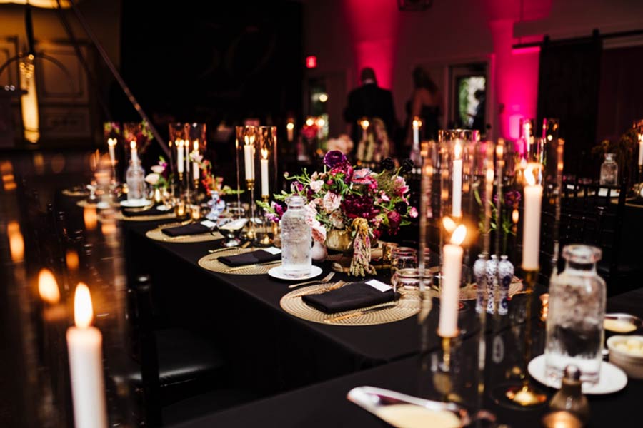 Table Set With Black Linens For Wedding Reception